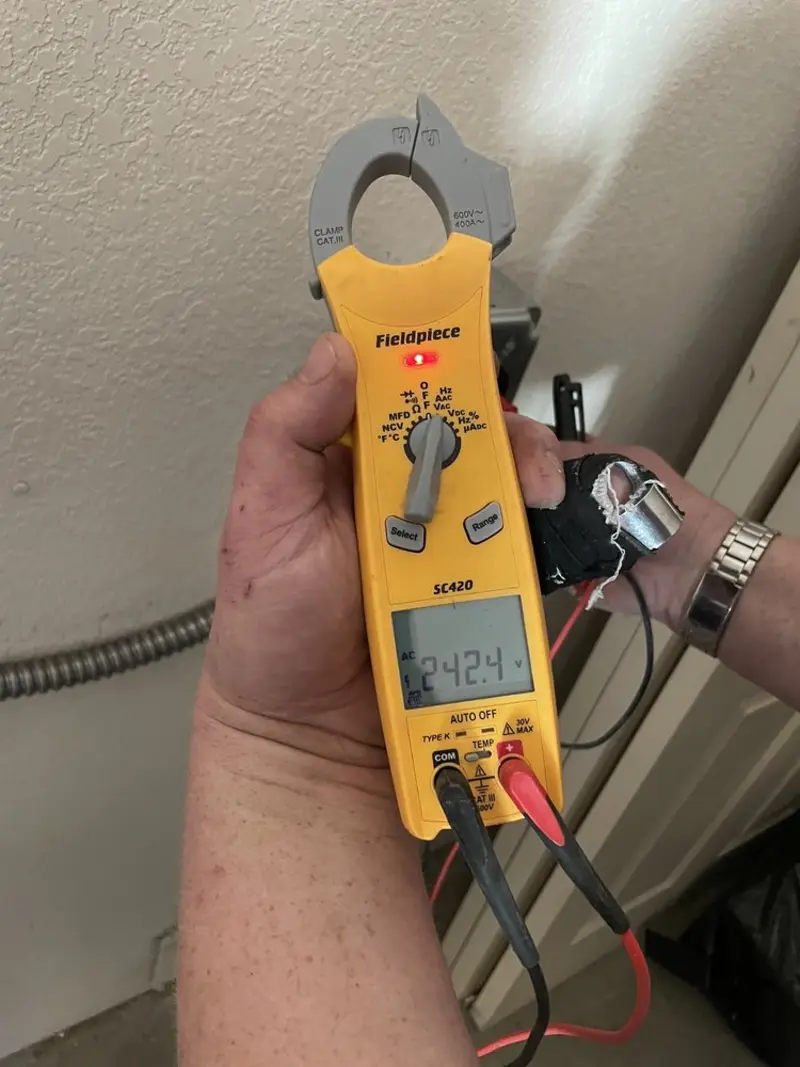 Voltage testing with clamp meter during Recessed Lighting Installation in University Park